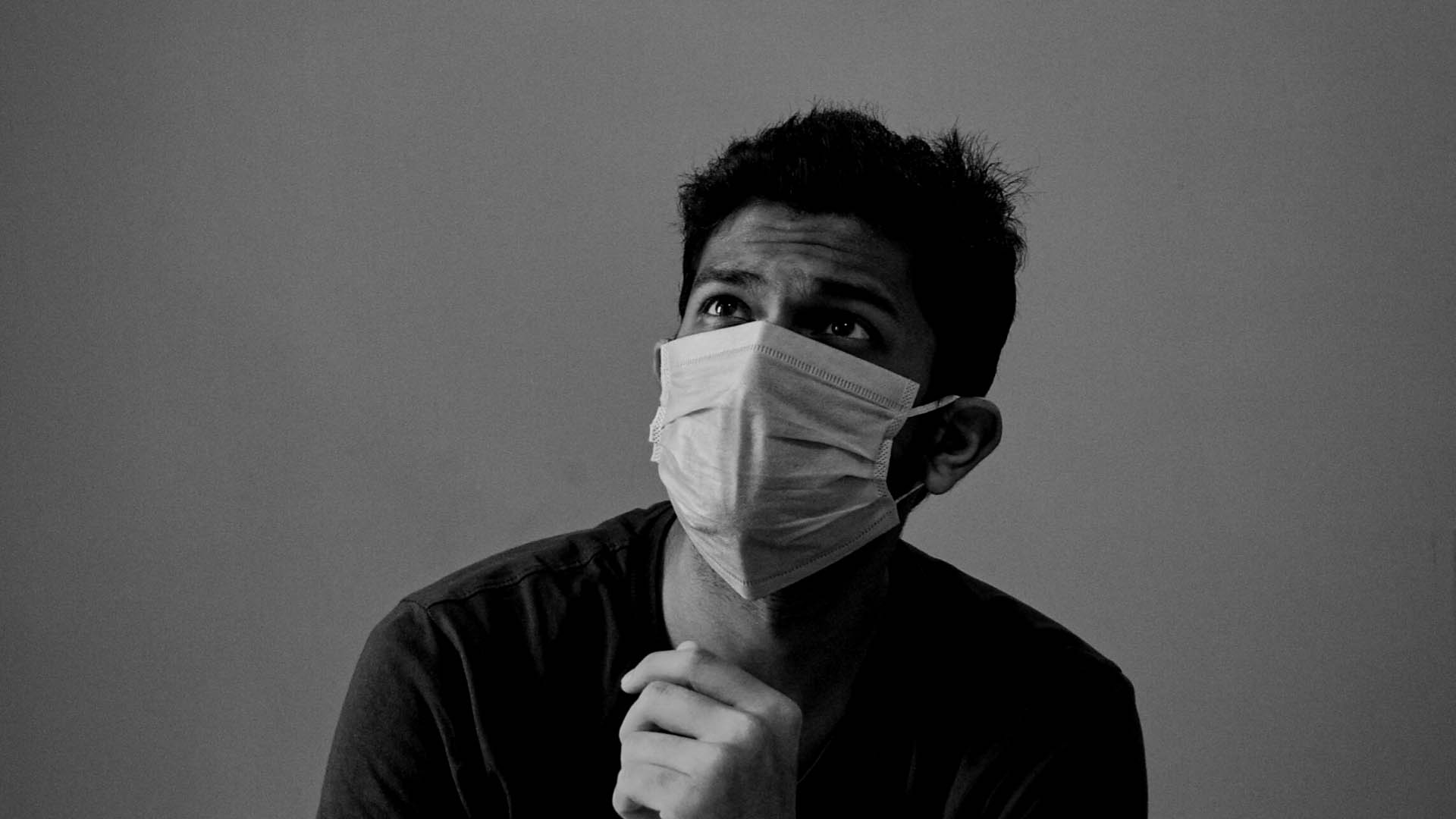 man in black long sleeve shirt wearing face mask