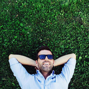man laying on grass